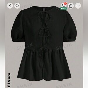 New black and super cute top size Large. Never used (it doesnt fit me)